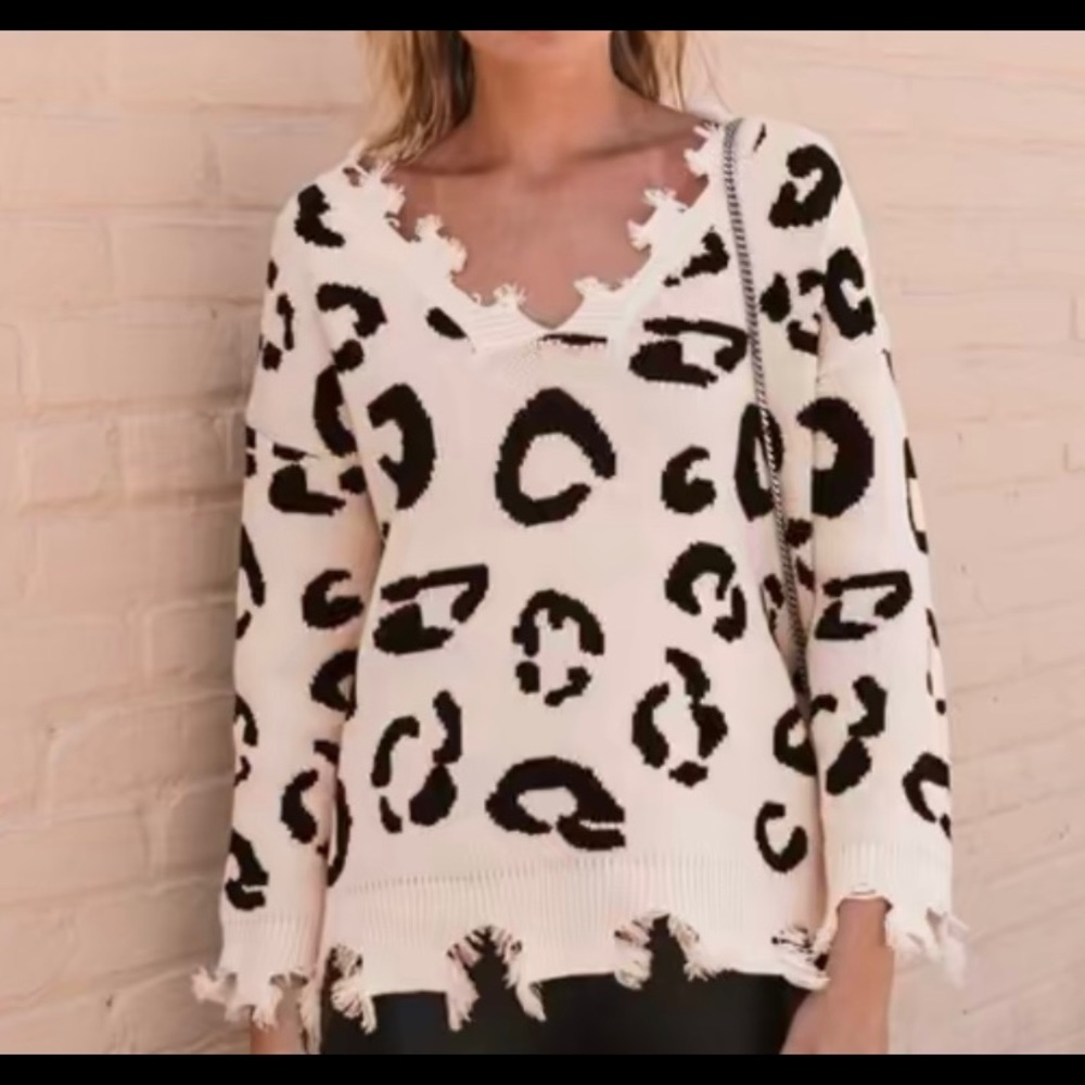 Distressed cheetah print sweater